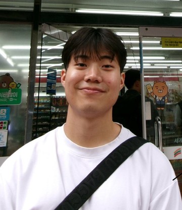 Branden outside a 7-Eleven in Korea